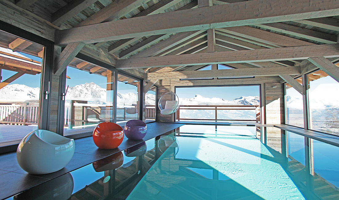 an indoor pool with mountain view